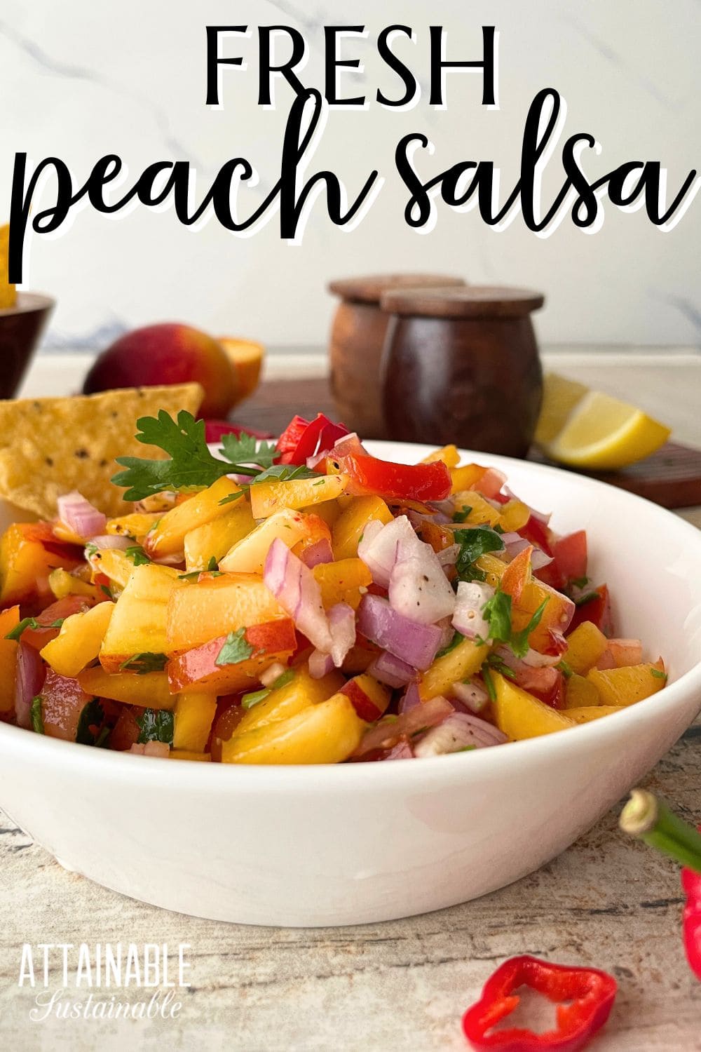 white bowl with words reading fresh peach salsa.