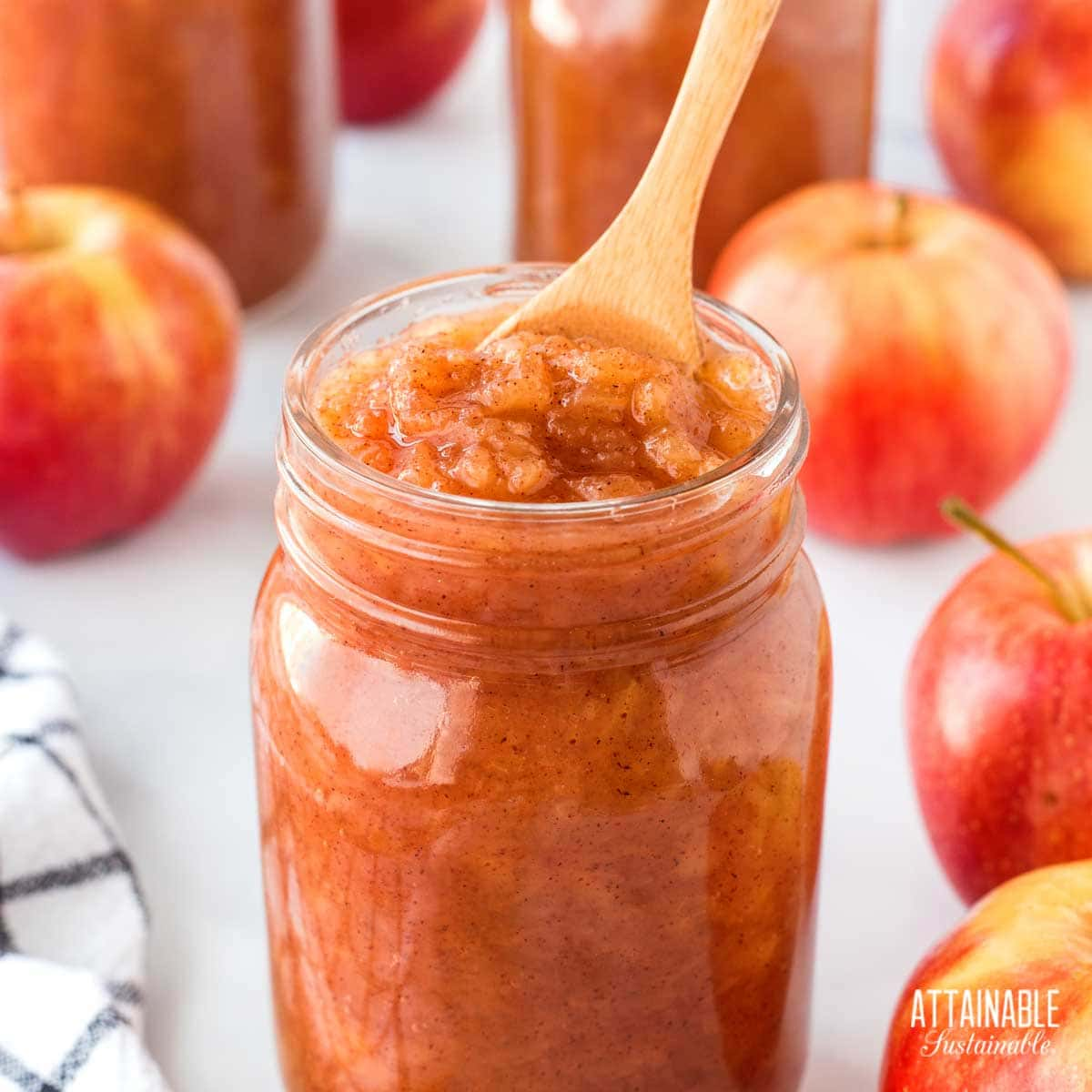 wooden spoon in a jar of homemade applesauce.