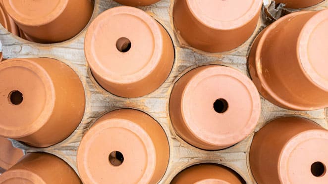 clay pots showing drainage holes. 