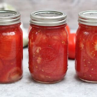 3 jars of crushed tomatoes in canning jars