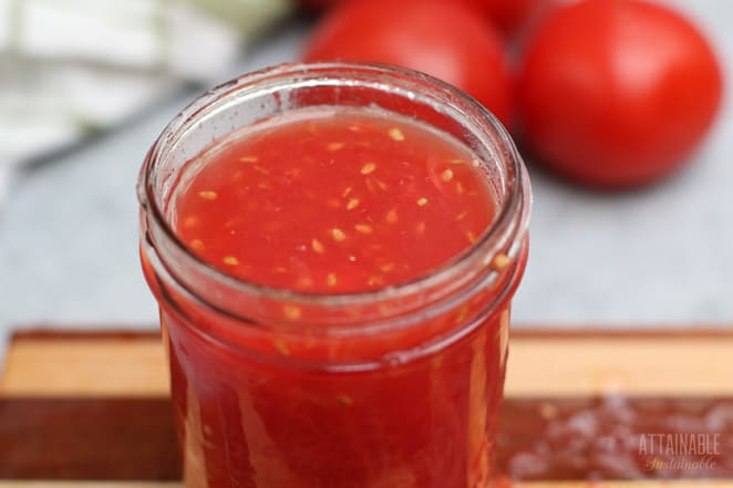 canning jar full of crushed tomatoes