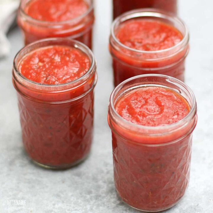 jars of pizza sauce before lids are tightened on.