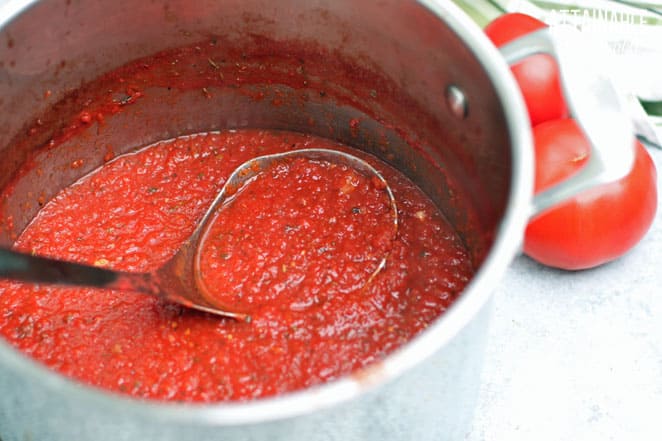 thickened and seasoned pizza sauce in a stock pot
