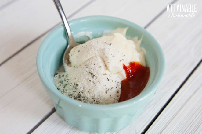 small teal bowl with mayo, sriracha, and seasonings