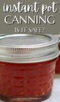 close up of canning jar full of red jam