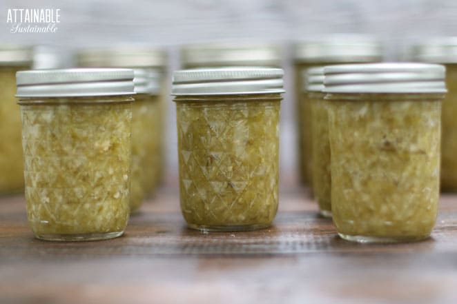 half pint canning jars filled with green tomato relish