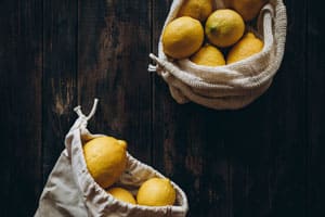 cloth bags with lemons on a dark background