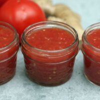 3 quarter pint jars of tomato jam with no lids