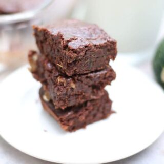 stack of brownies on a white plate