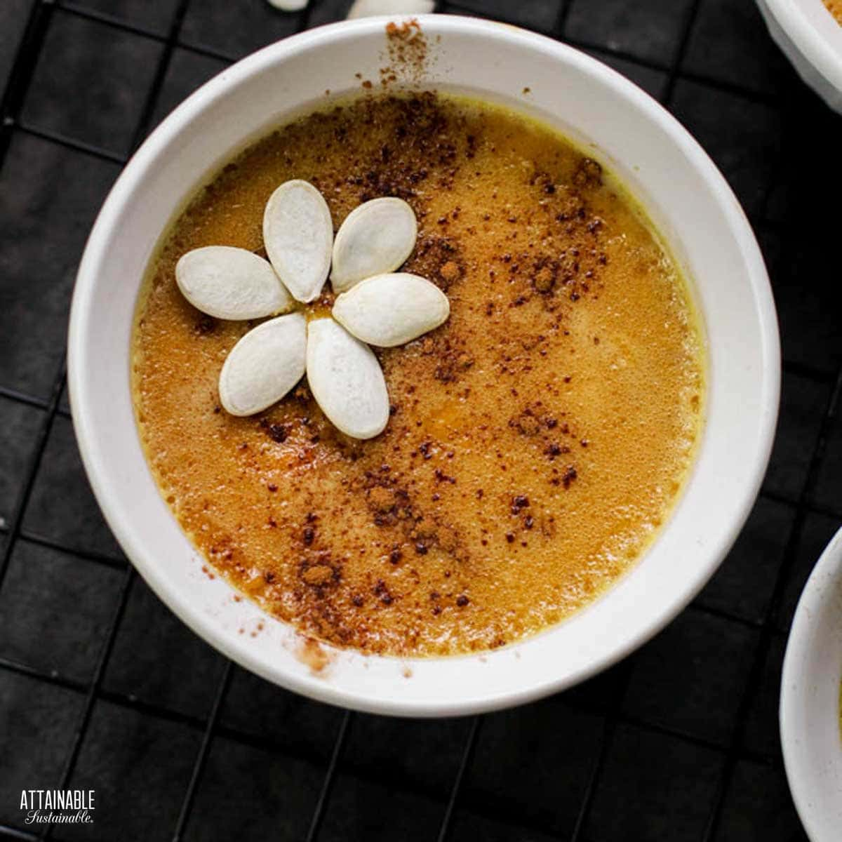 pumpkin custard with white pumpkin seed flower on top.