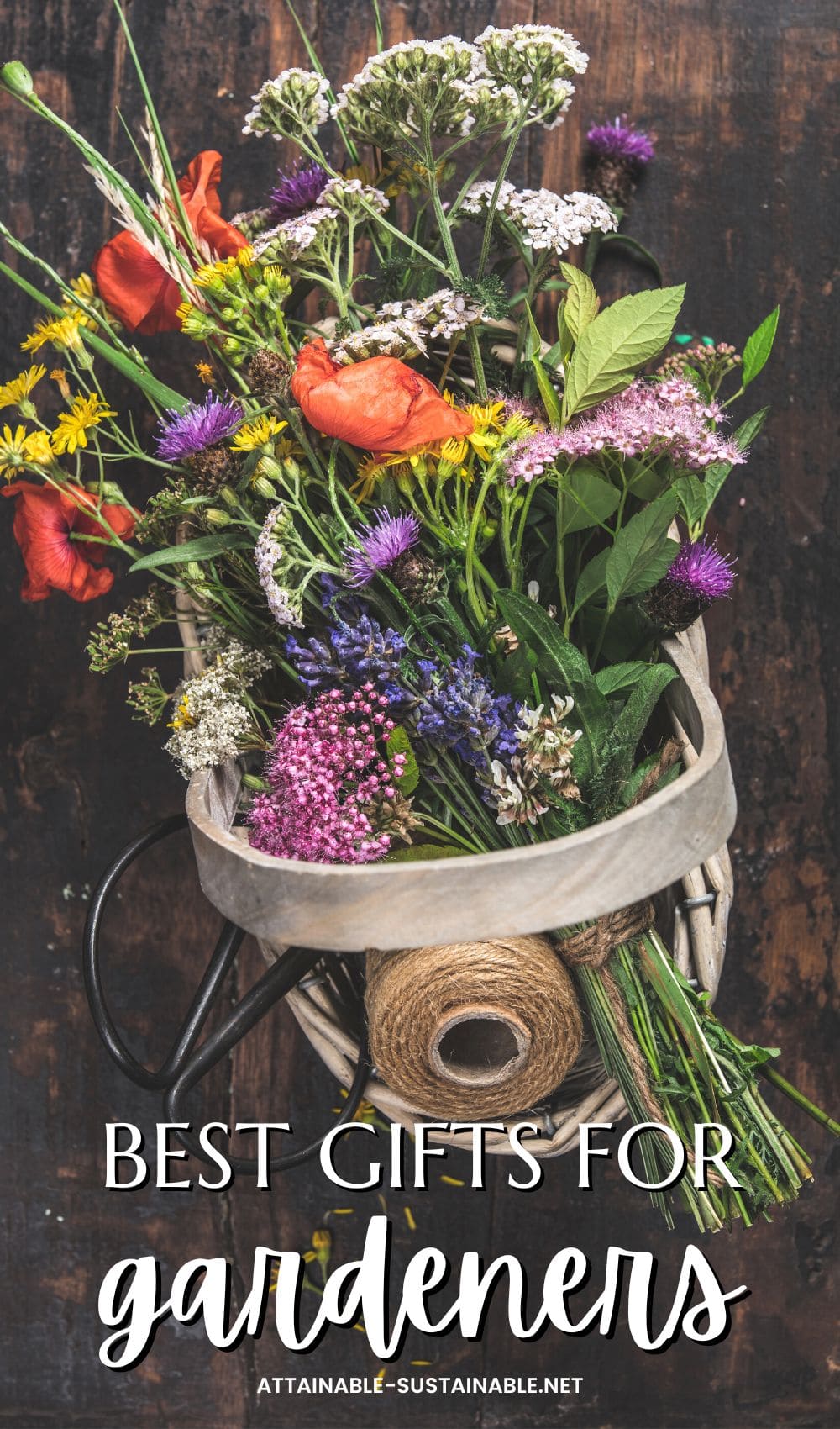bright bouquet of flowers in a wooden basket on a dark background.