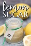 small glass jar full of lemon sugar.
