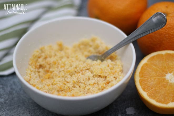 white bowl with orange sugar and a fork