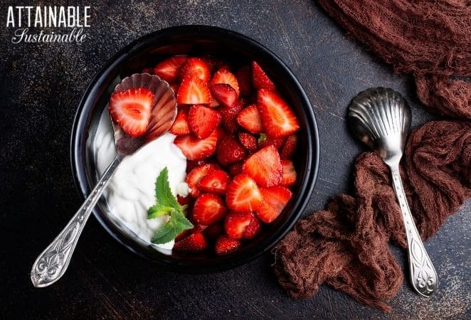 Strawberries and whipped cream in a bowl. 