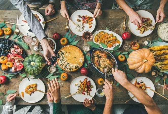 thanksgiving buffet from above, lots of hands choosing food