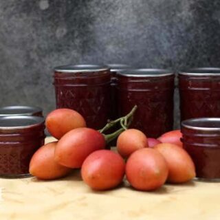 jars of red jam with tamarillo fruit