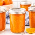 JARS of bright orange tangerine marmalade.