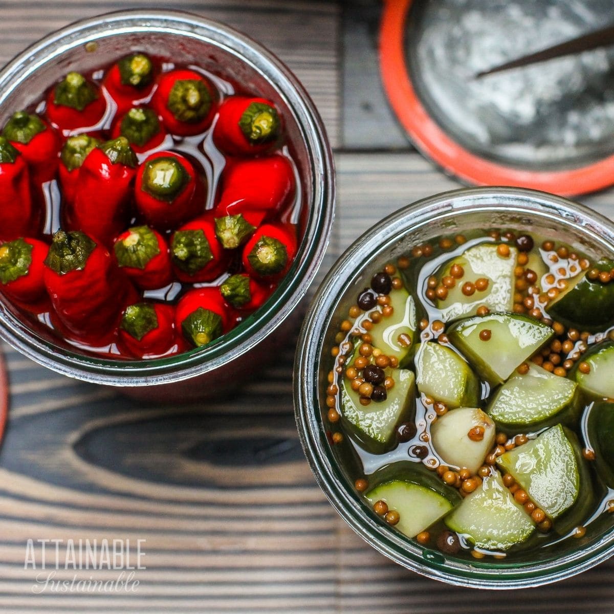 bright red pepper pickles and cucumber pickles in jars from above.