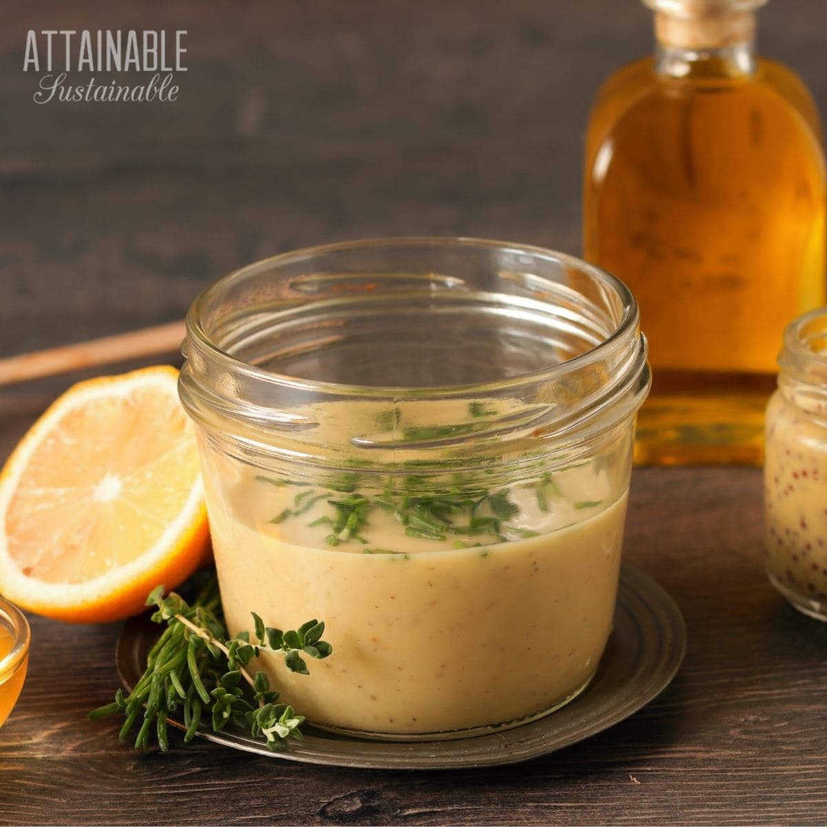 jar of yellow dressing with lemon half.