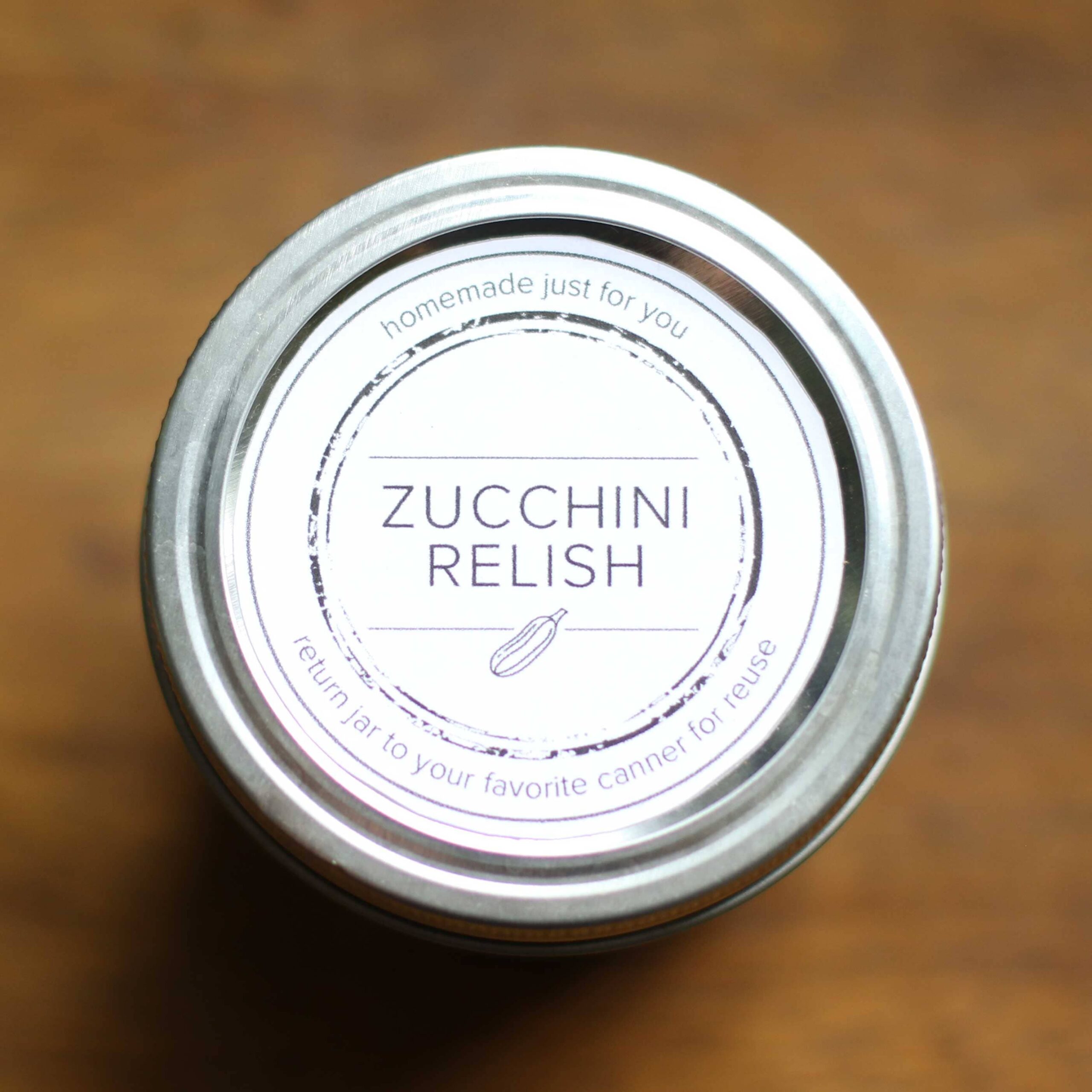 canning jar with a label reading zucchini relish.