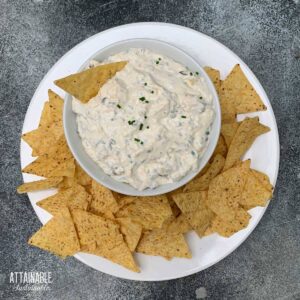 bowl of cream cheese dip with tortilla chips from above.