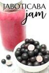 jaboticaba fruit in a bowl with a jar of pink juice.