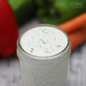 HOMEMADE ranch dressing in a jar with lid off.