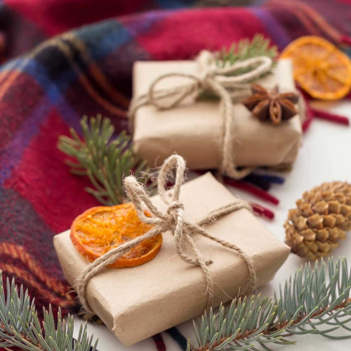 dried orange slice on top of a brown wrapped gift.