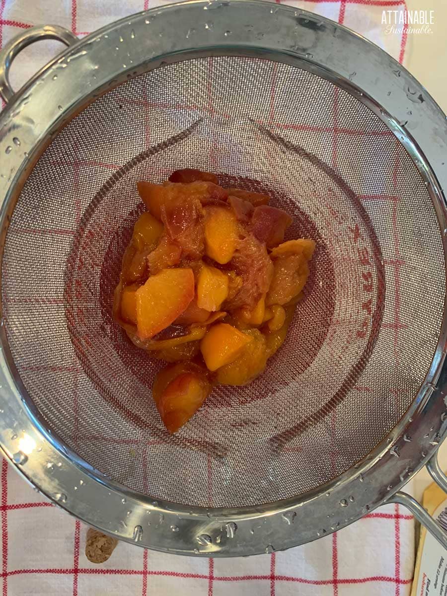 peaches in a strainer from above. 