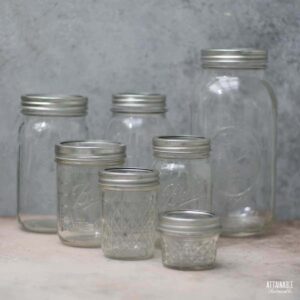 variety of canning jar sizes visible with empty jars.