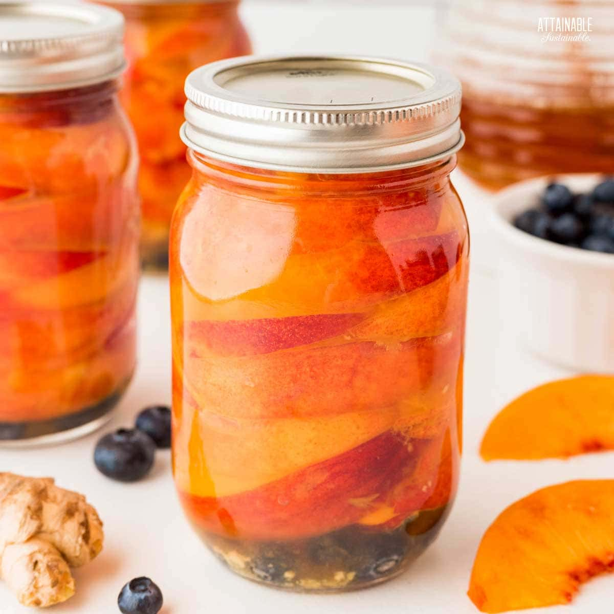 jar of home canned nectarines.