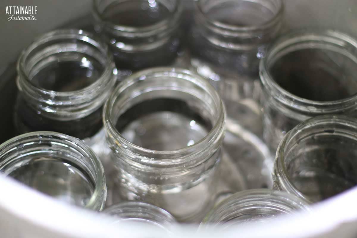 empty jars in a pot of water.