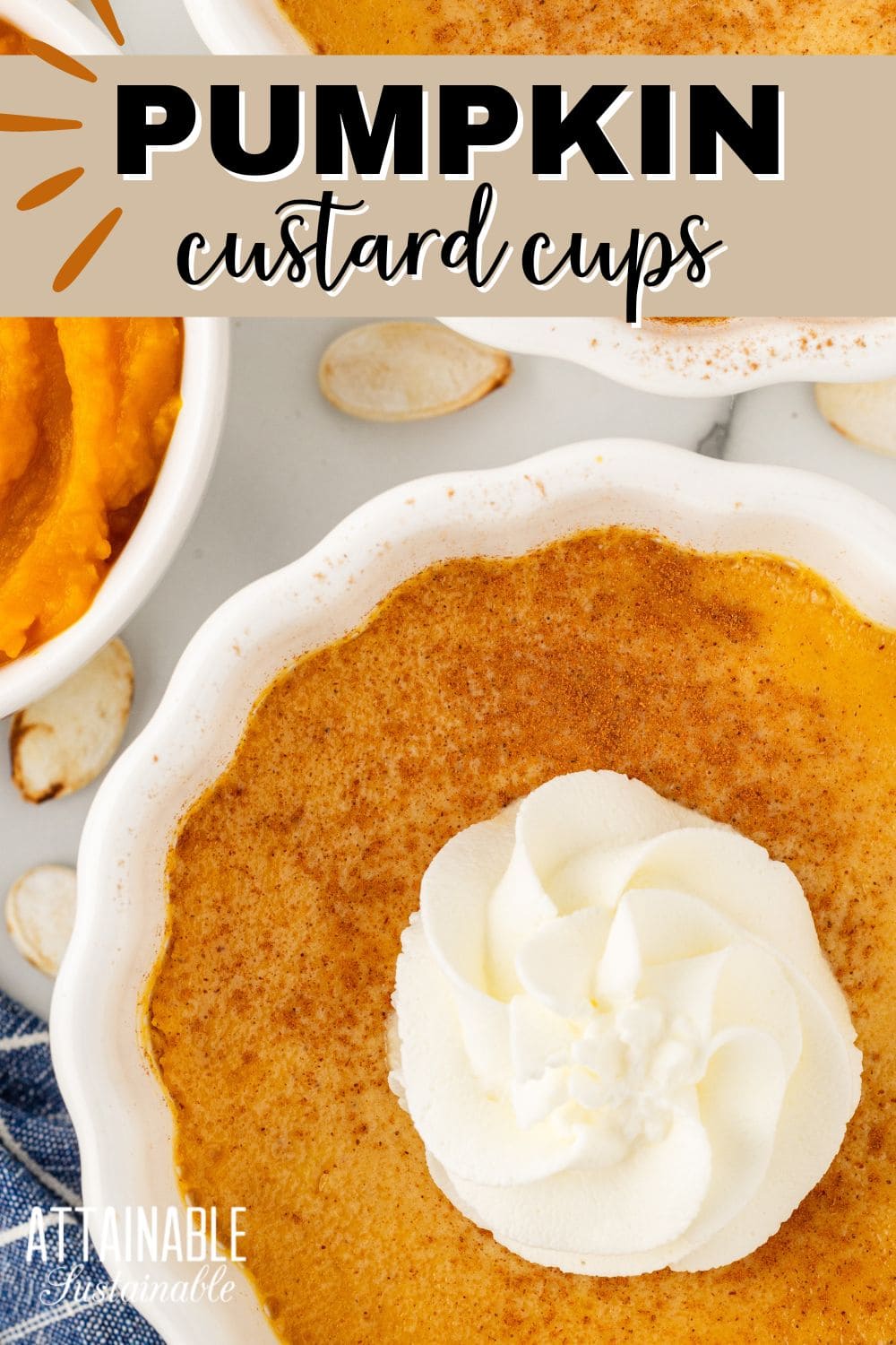 pumpkin custard in scalloped white cups with a dollop of whipped cream, from above. 