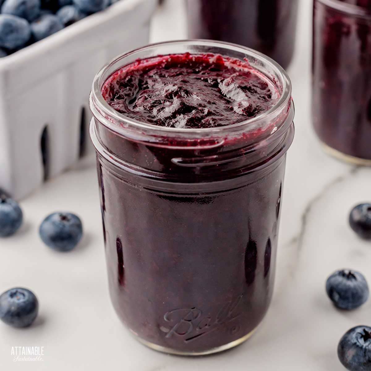 jar of open blueberry jam.