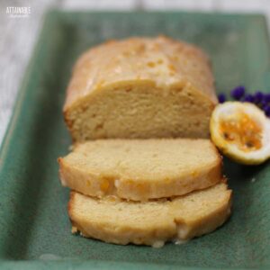 passion fruit loaf cake on a green platter.