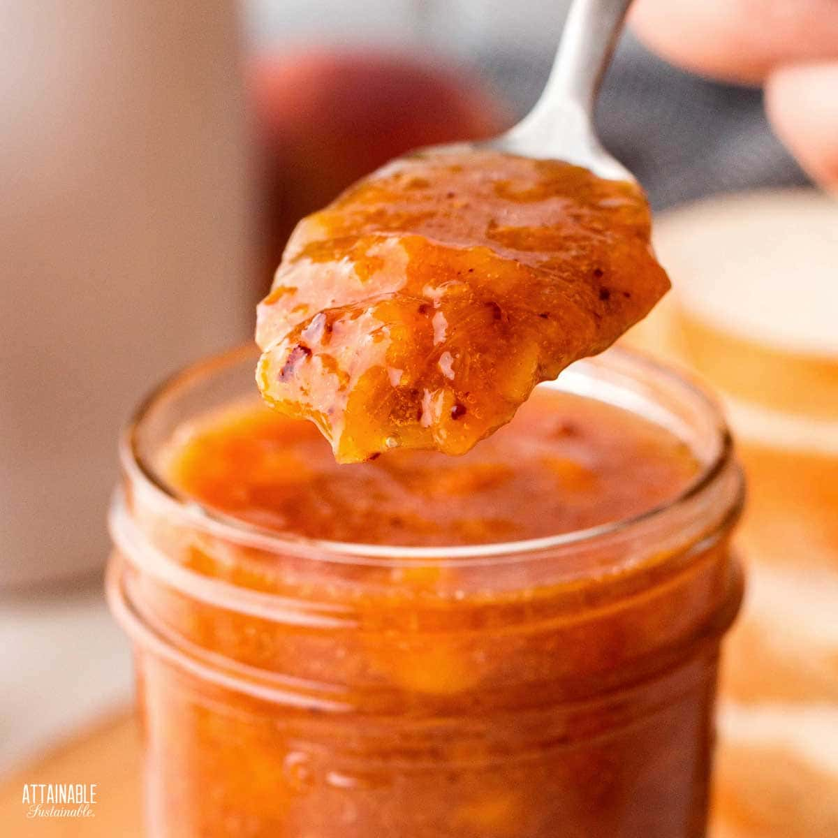 peach preserves on a spoon.