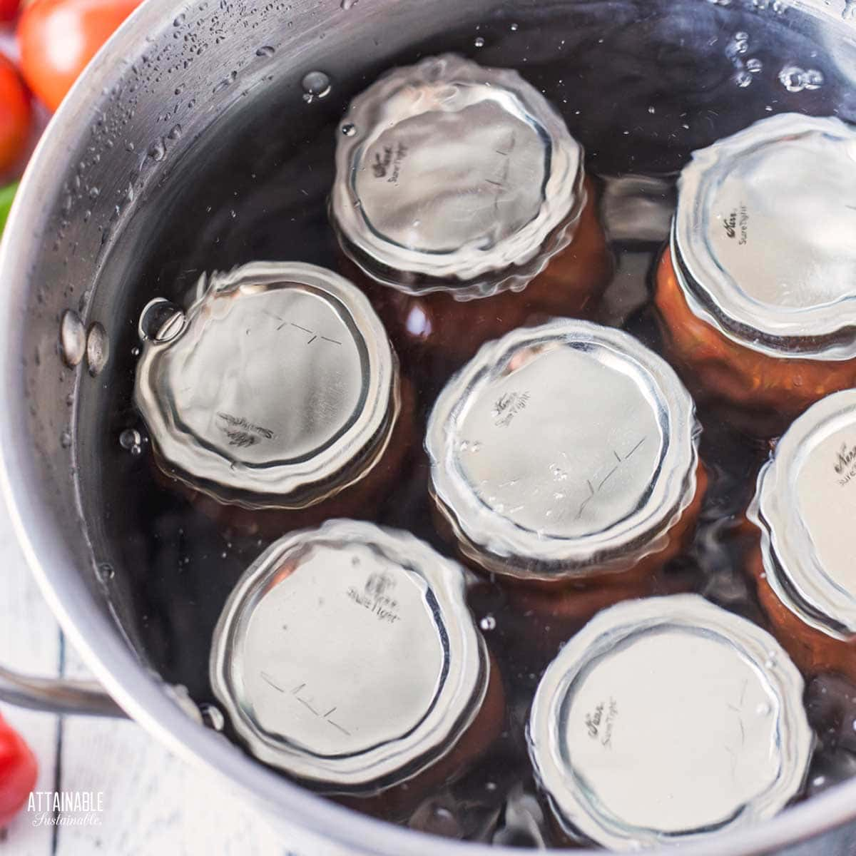 pot of water with jars for canning.