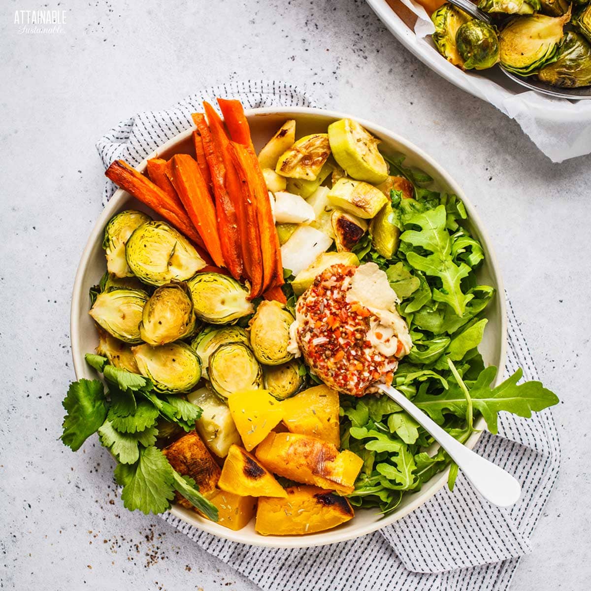 bowl with roasted veggies and hummus from above.