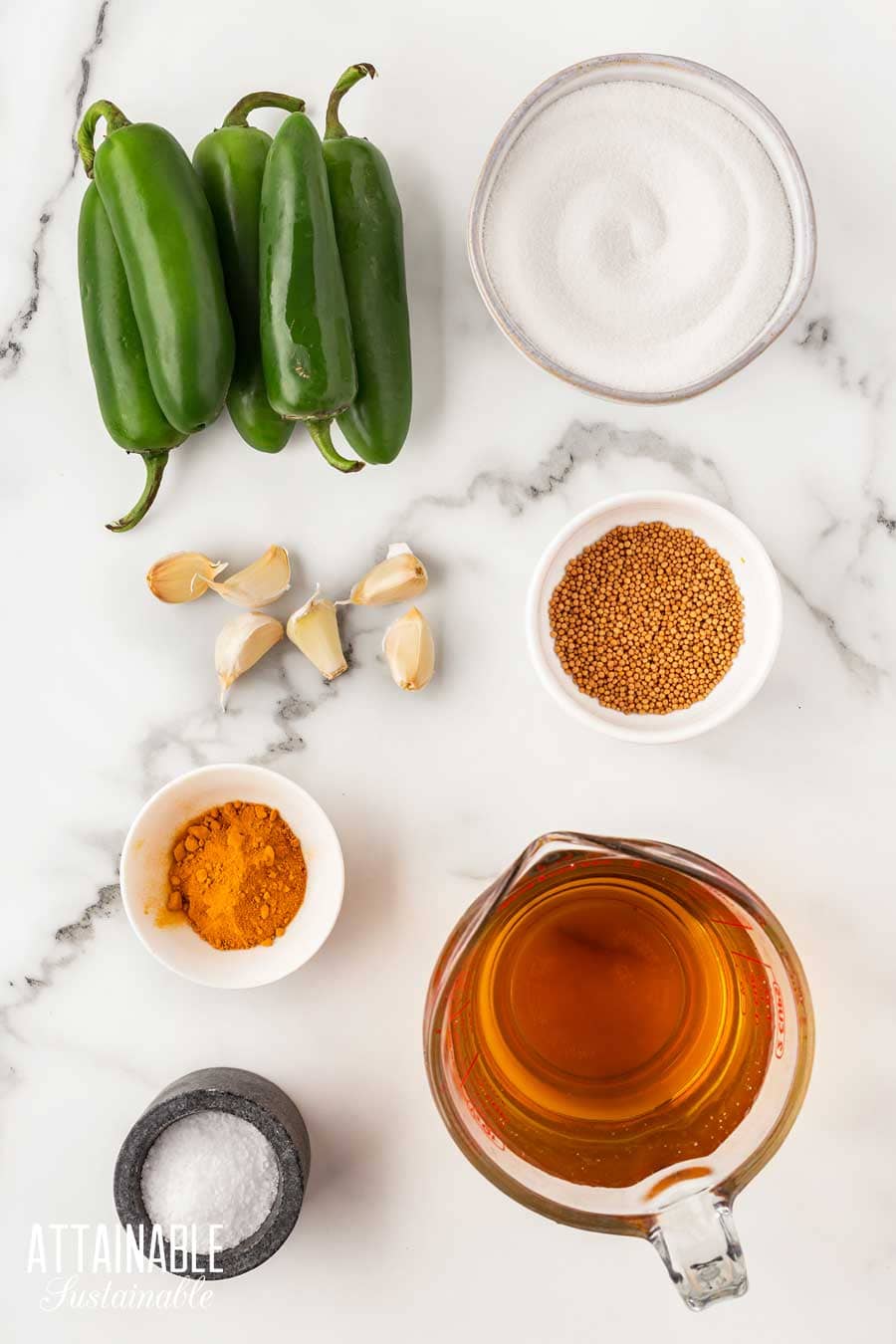 ingredients for candied jalapenos on a white background.