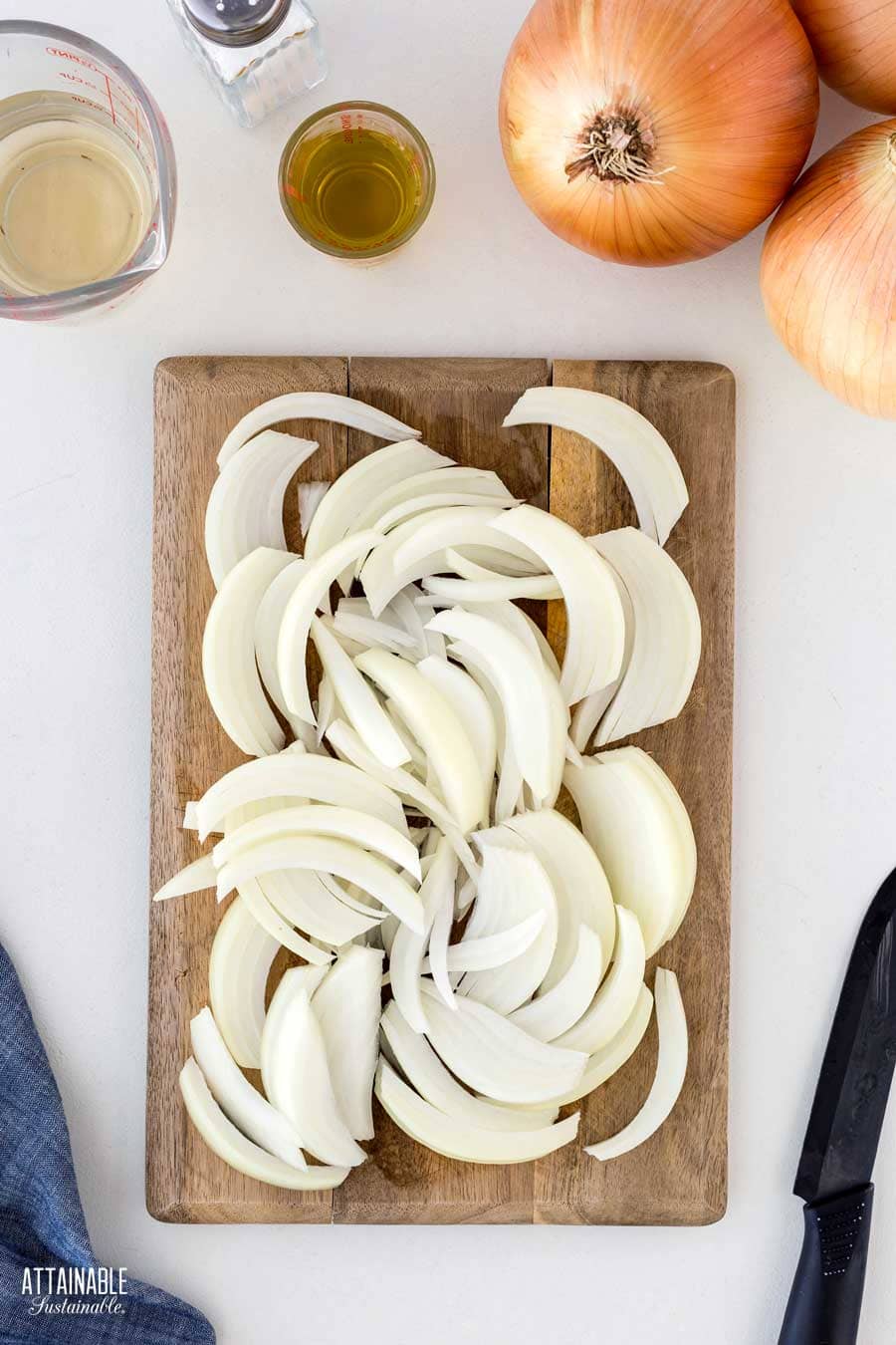 sliced onions on a cutting board.