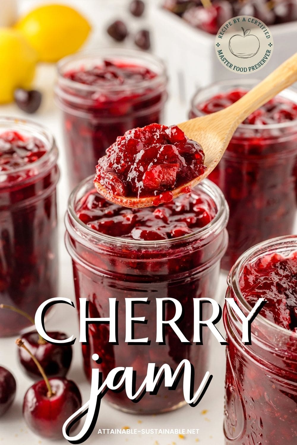 jars of cherry jam, one wooden spoon scooping jam out of a jar.