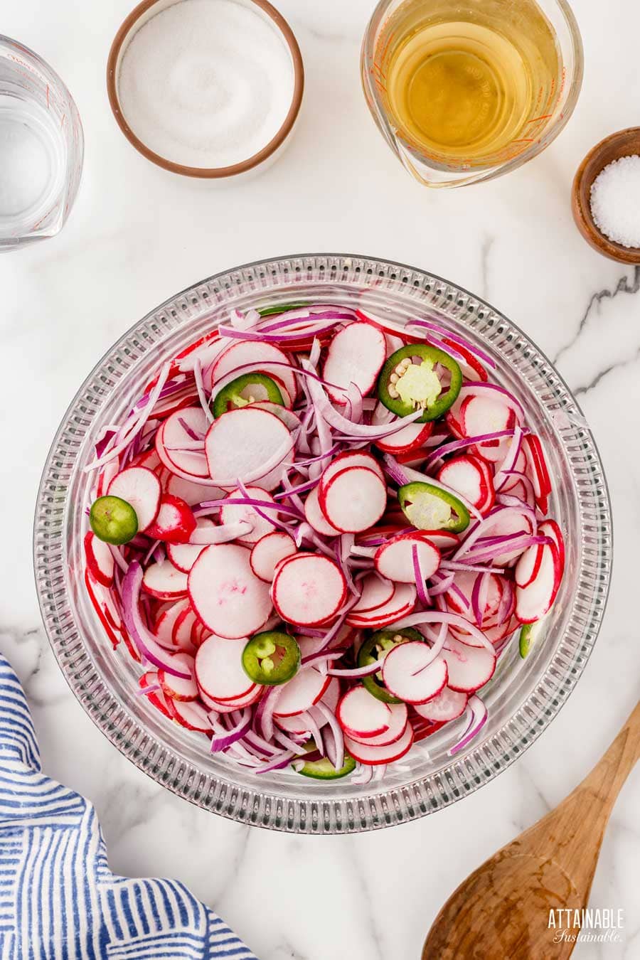 sliced vegetables in a glass bowl.