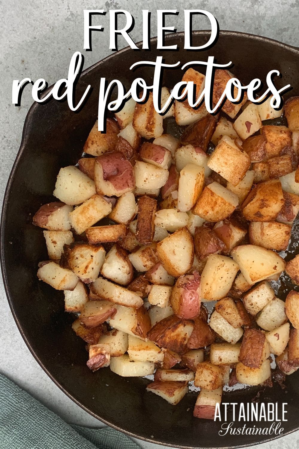 fried red potatoes, cooked golden brown in a cast iron skillet, from above.