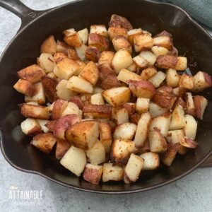 fried red potatoes, cooked golden brown in a cast iron skillet.