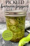 single jar of banana pepper rings with lid on, ready to be refrigerated. Text overlay says: pickled banana peppers canning or refrigerator pickle recipe.