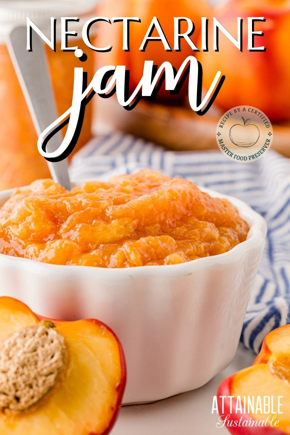 nectarine jam in a white dish with a spoon, halves of nectarines in front.