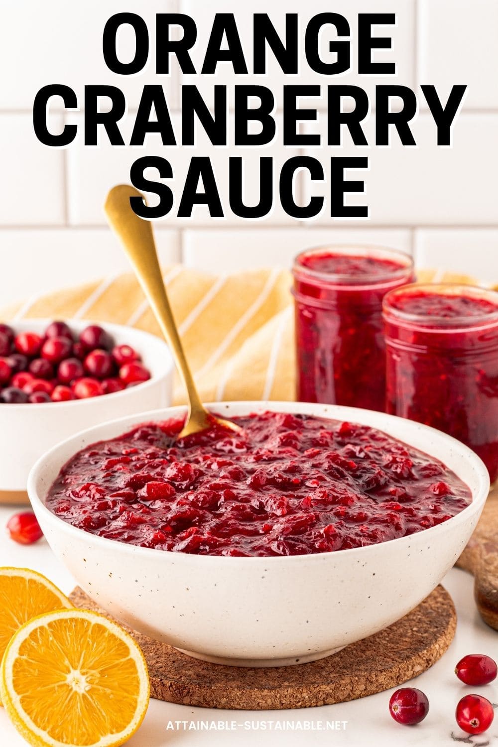 white bowl full of cranberry sauce with a spoon sticking out of it. 