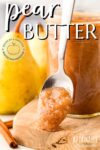 pear butter on a spoon, leaning against an open jar of pear butter.