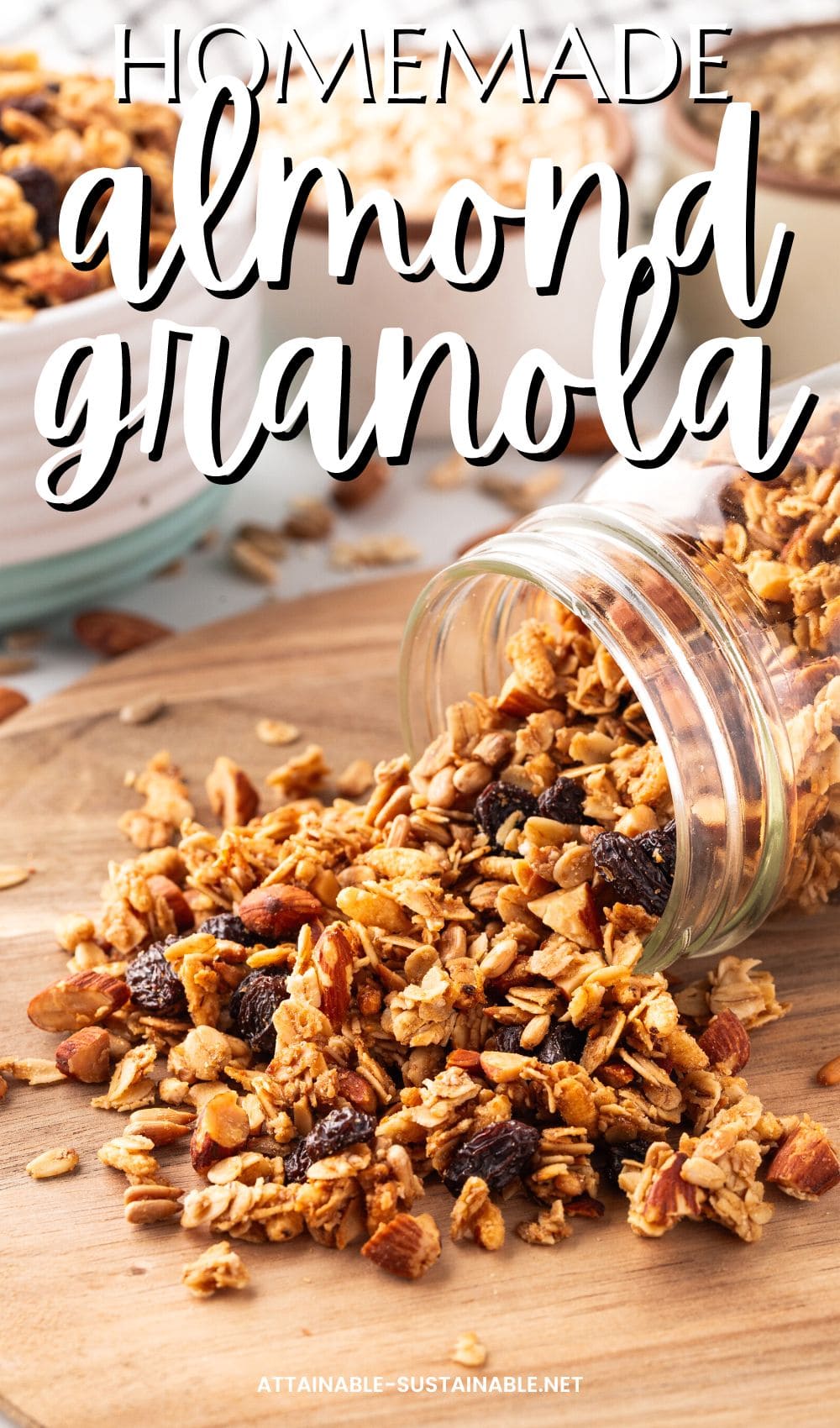 toasty brown granola in a glass jar on a wooden surface, some spilling out.