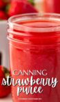 close up of canning jar full of strawberry puree, lid off.